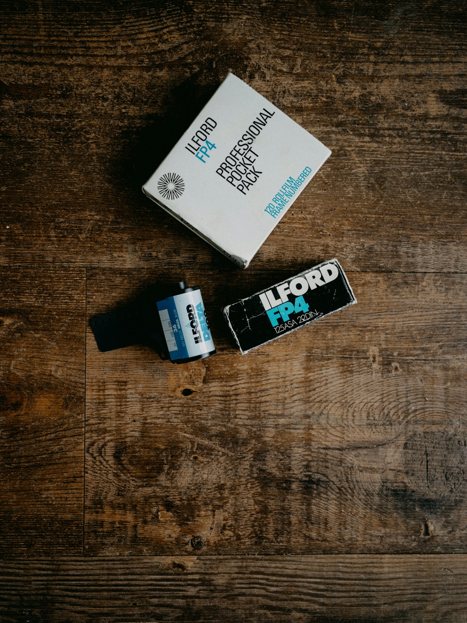 AA batteries on a wooden surface