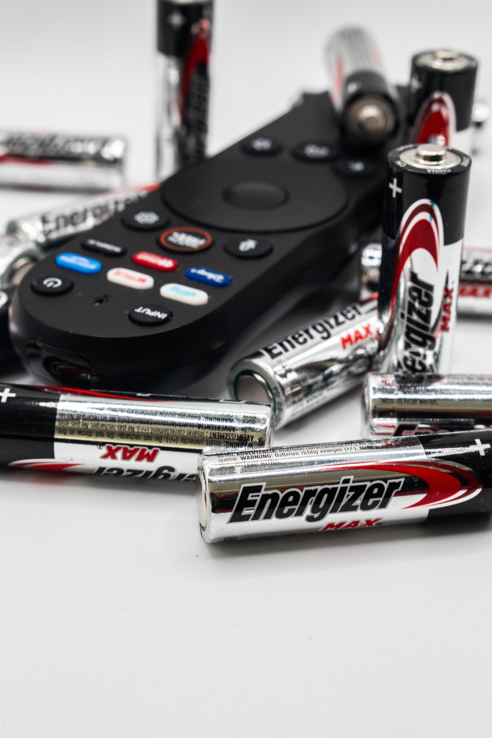 AA batteries beside a remote control