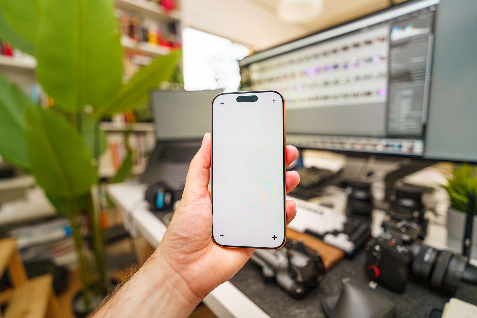 Smartphone and tech gear on a workspace