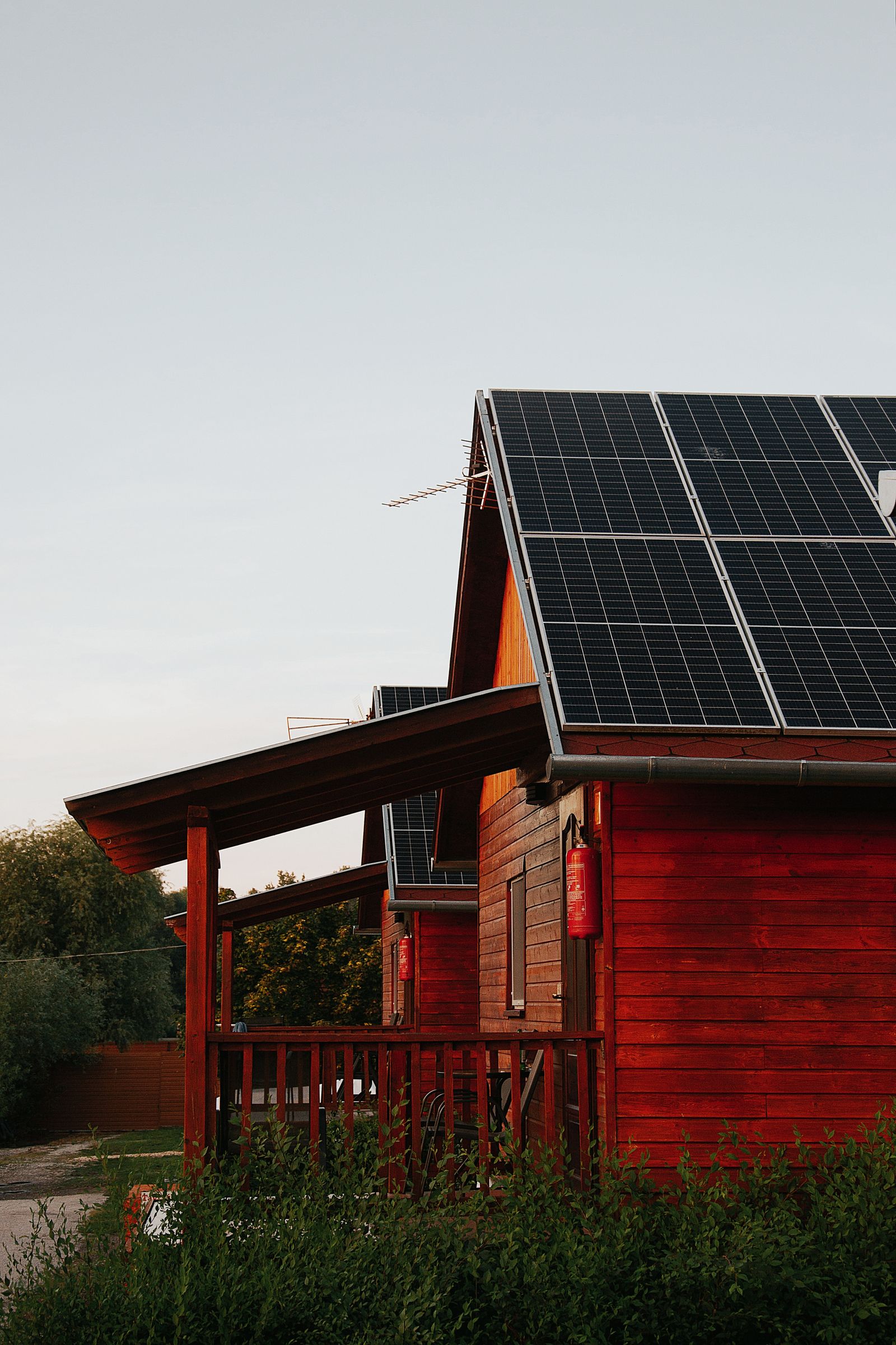 Wooden house with rooftop solar panels